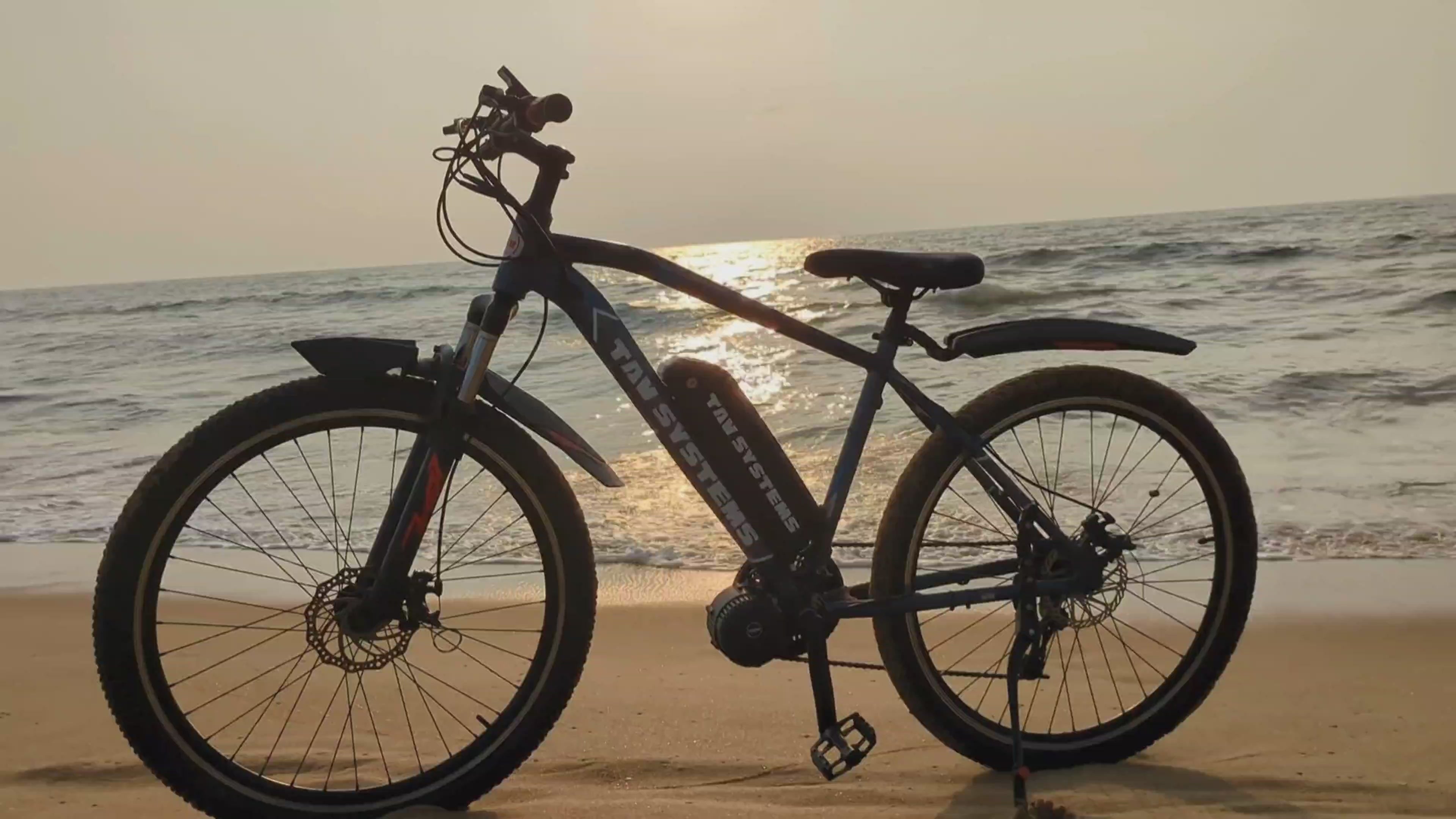 Load video: TAV Ebike conversion kit feature video with mid-drive motor, throttle, display and accessores for everyday use, thrilling rides and adventures